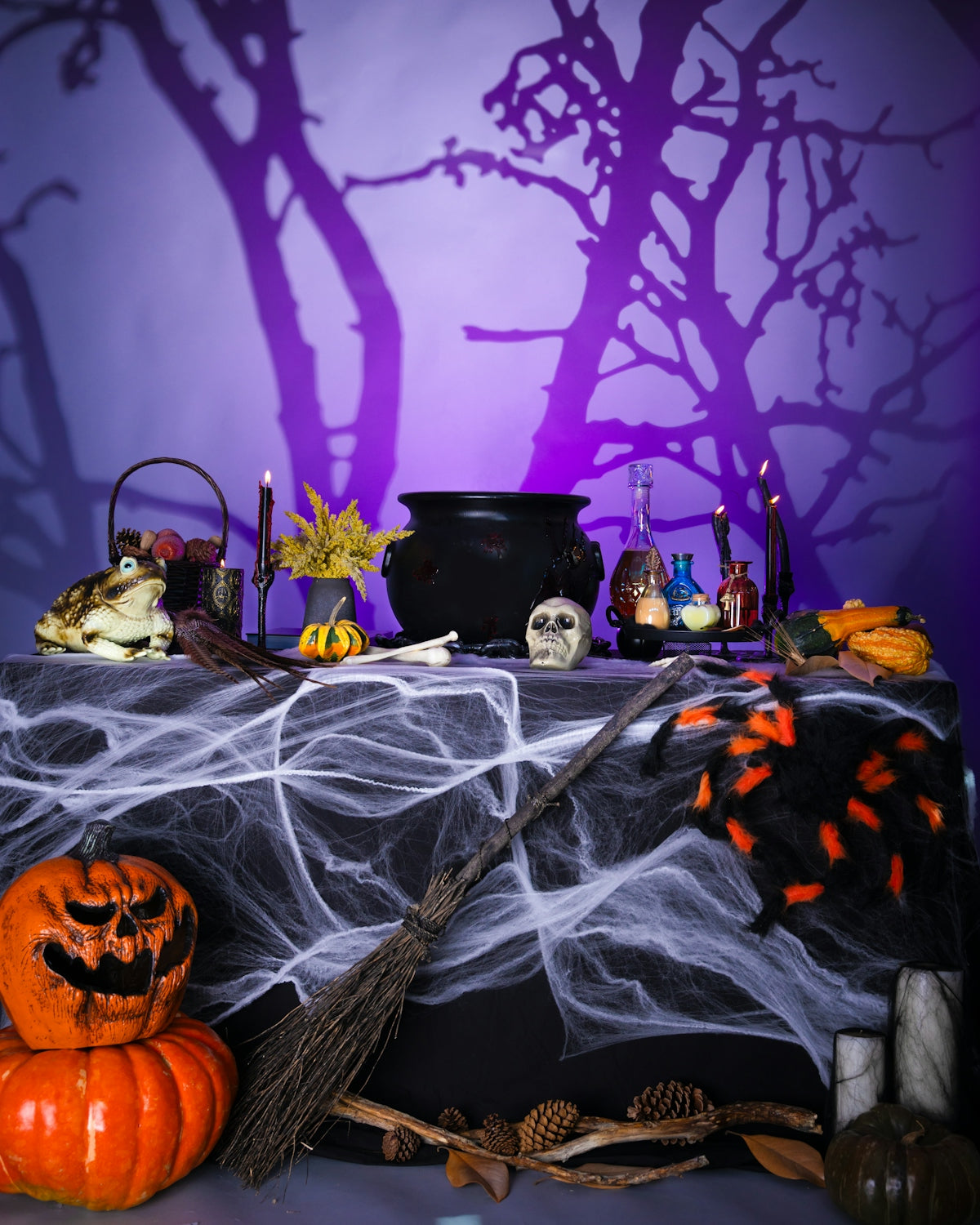 A table topped with lots of halloween decorations